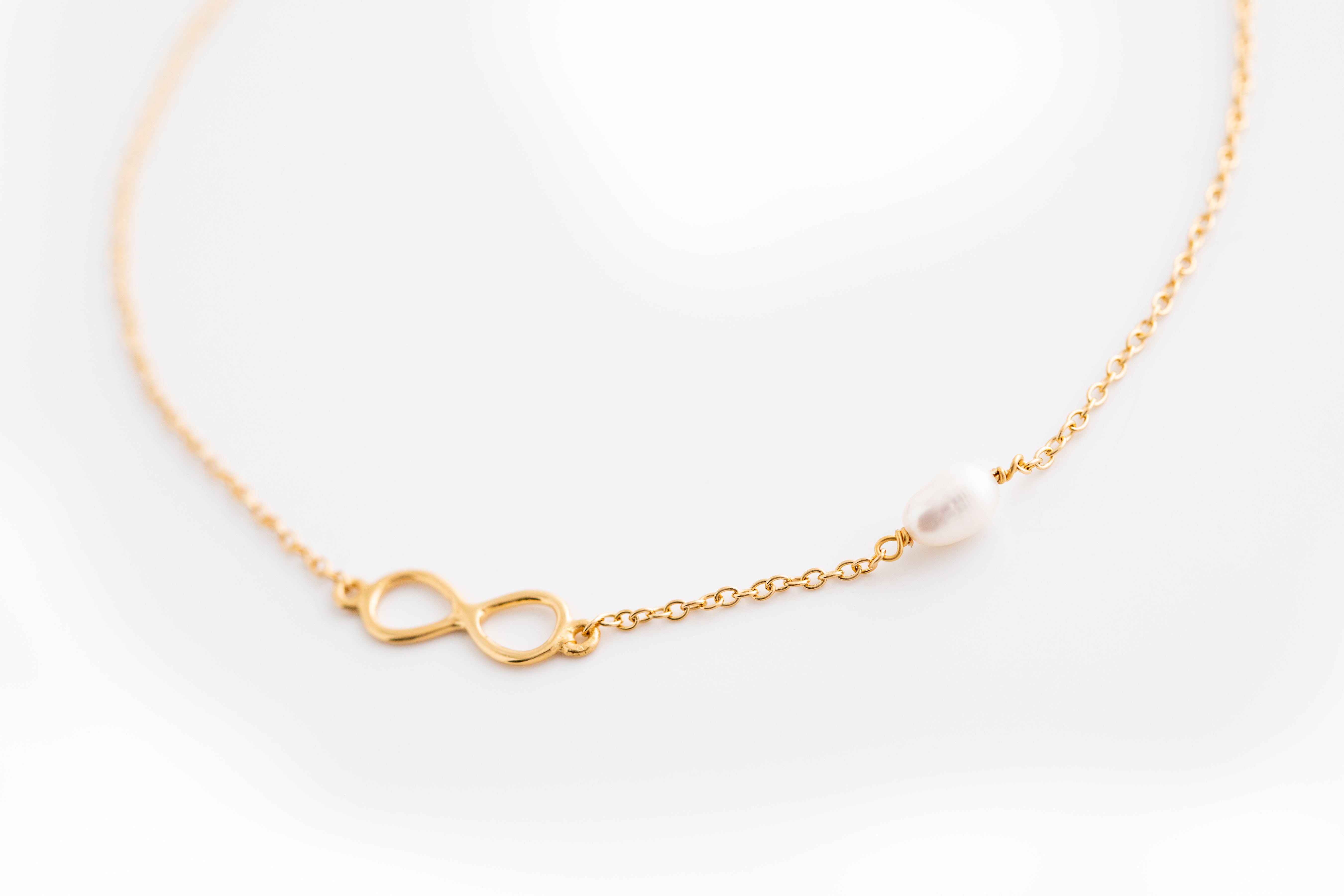Gold Infinity Bracelet with Pearl