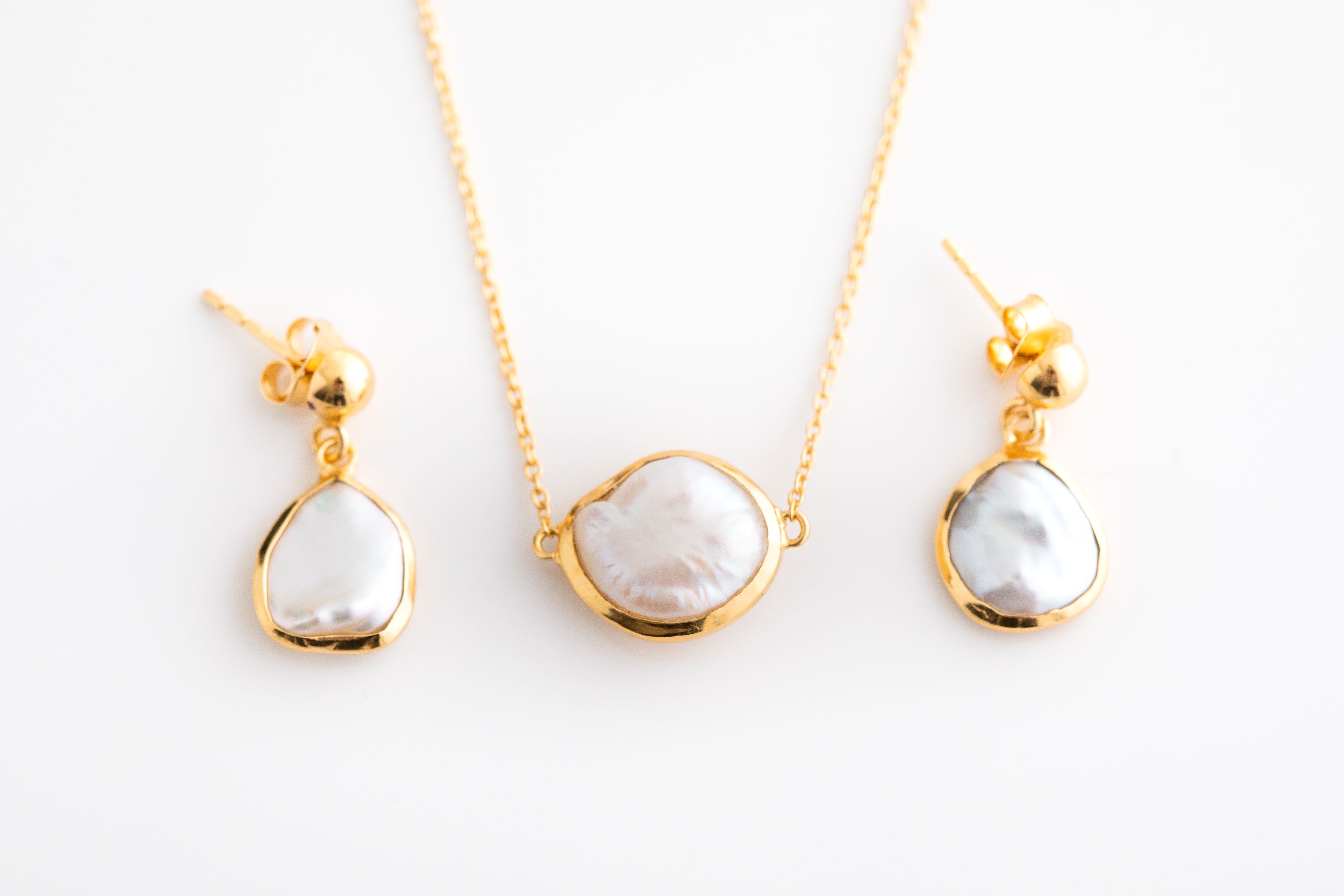 Pearl Drop Earrings in a Gold Setting